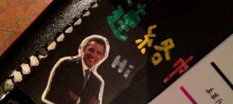 A cutout of Barack Obama on the cover of an address book.
