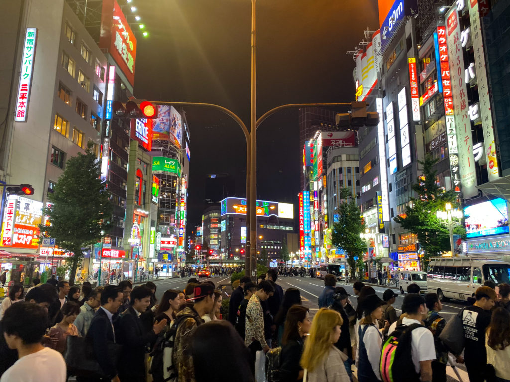 Busy street in Shinjuku, Tokyo in the evening. iPhone 11 Pro standard camera.