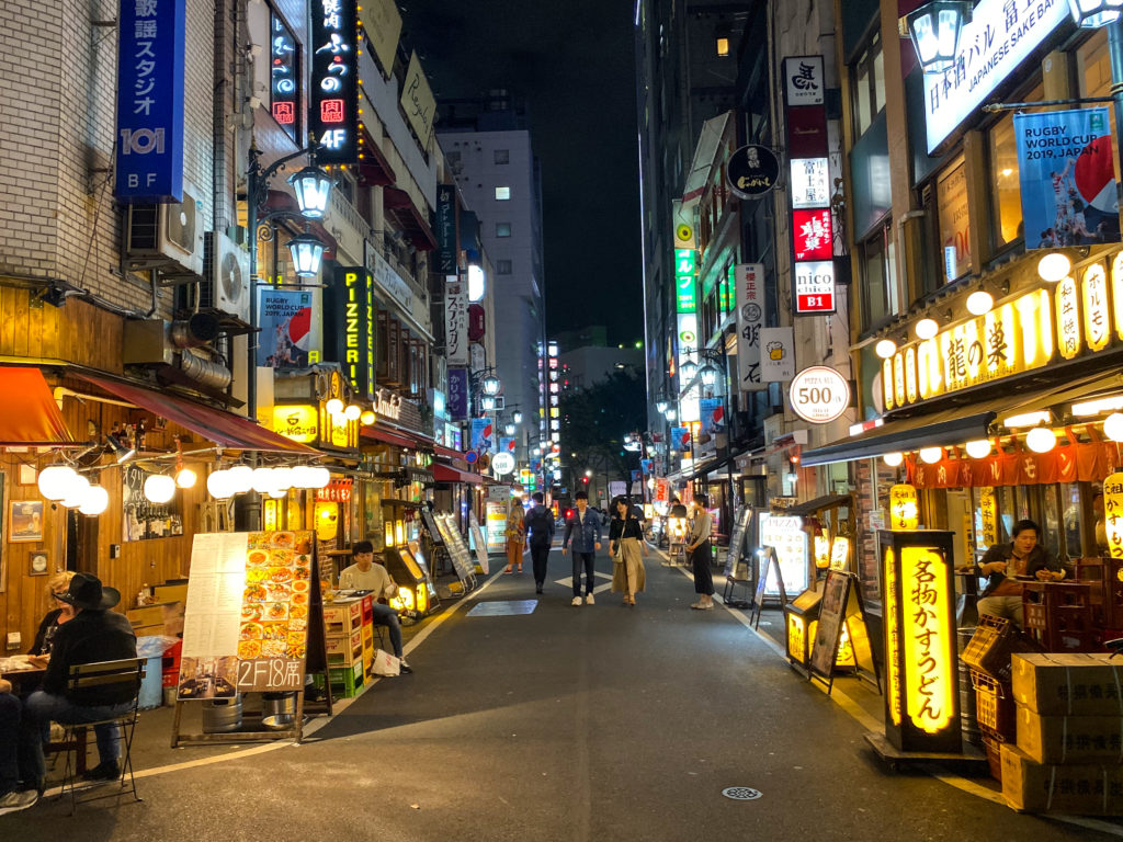 Backstreet of Shinjuku San-chome in the evening. iPhone 11 Pro standard camera with 1 second night mode exposure.